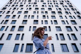 
		Lonely employees in front of office building
	